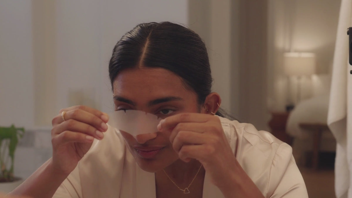Women applying Toute Nuit face tape